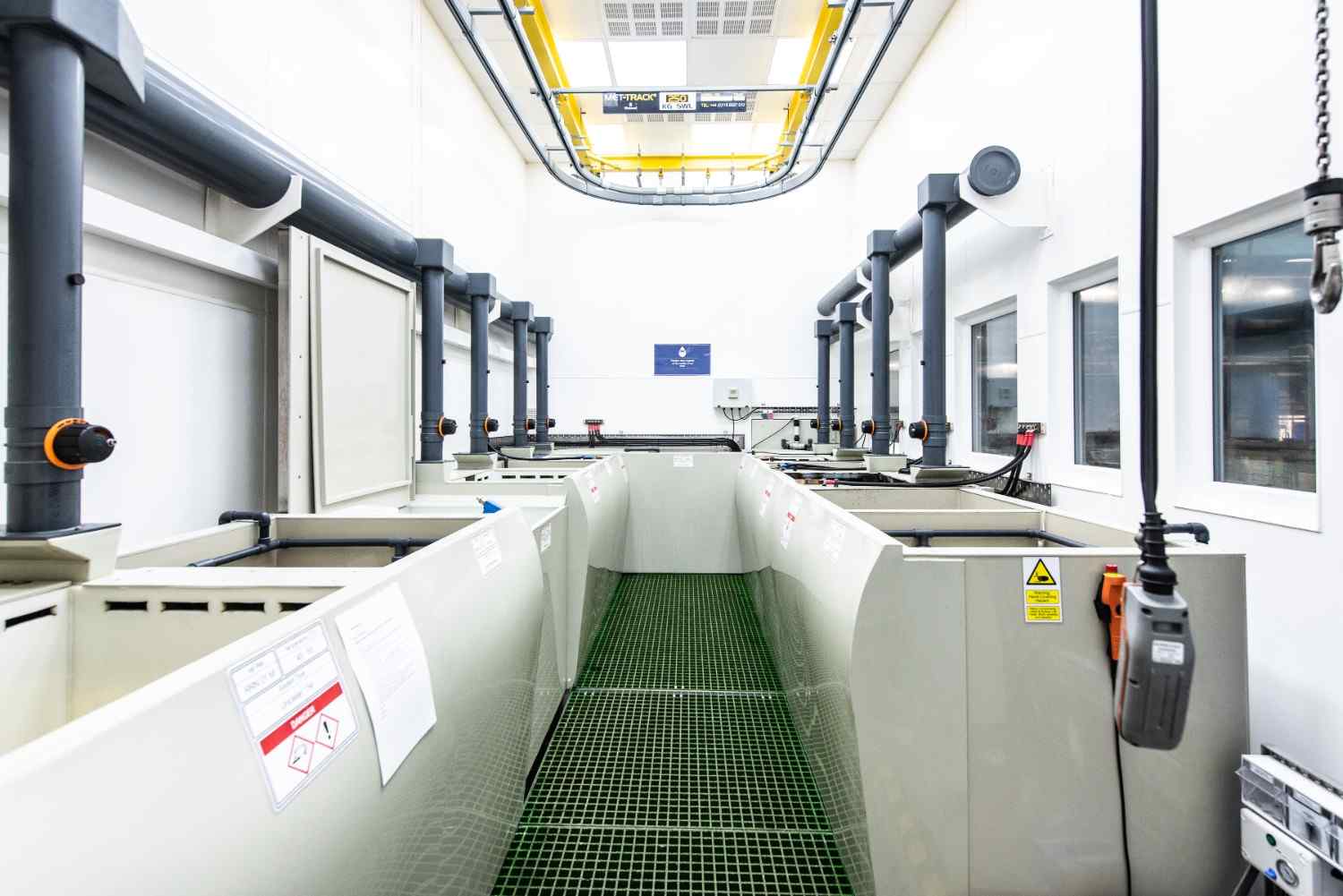 Poeton manufacturing facility interior showing production floor with anodising equipment and quality control systems